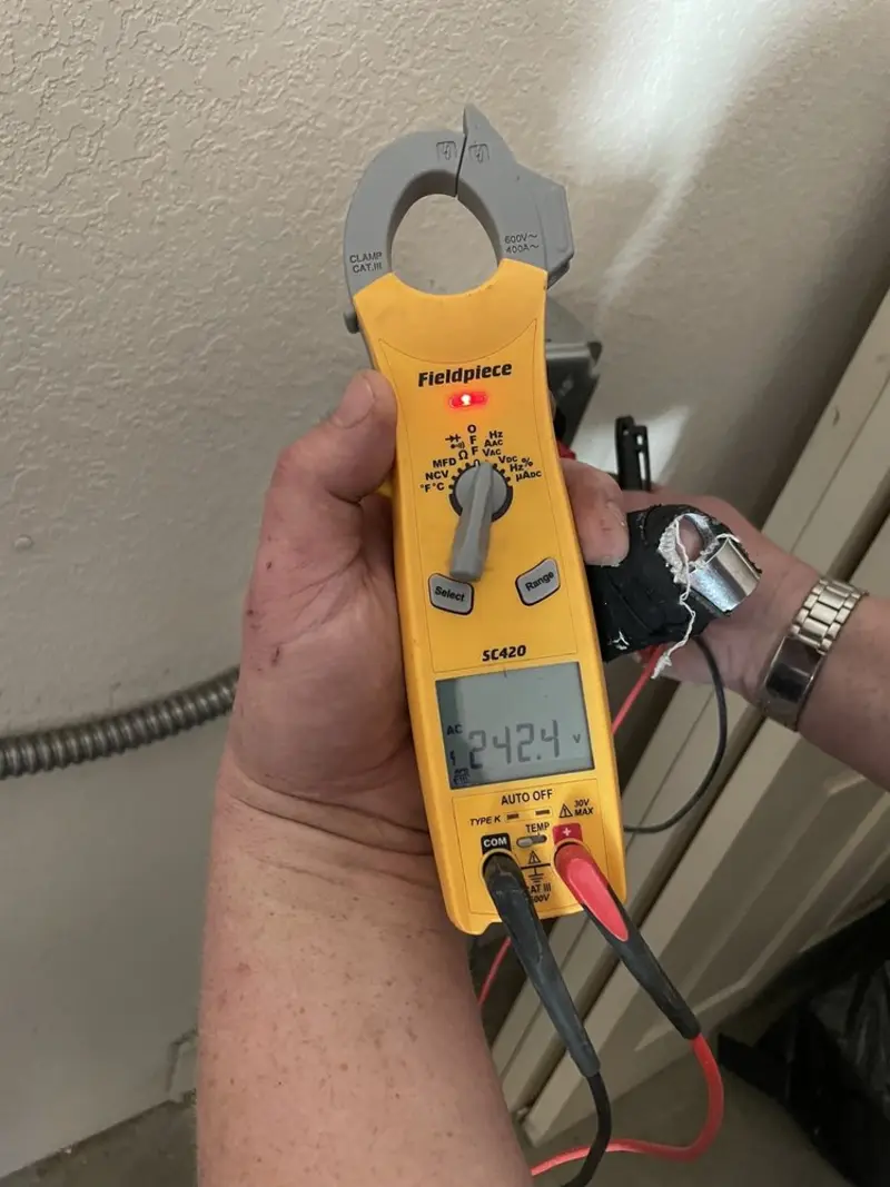 Voltage testing with clamp meter during Recessed Lighting Installation in East Coventry